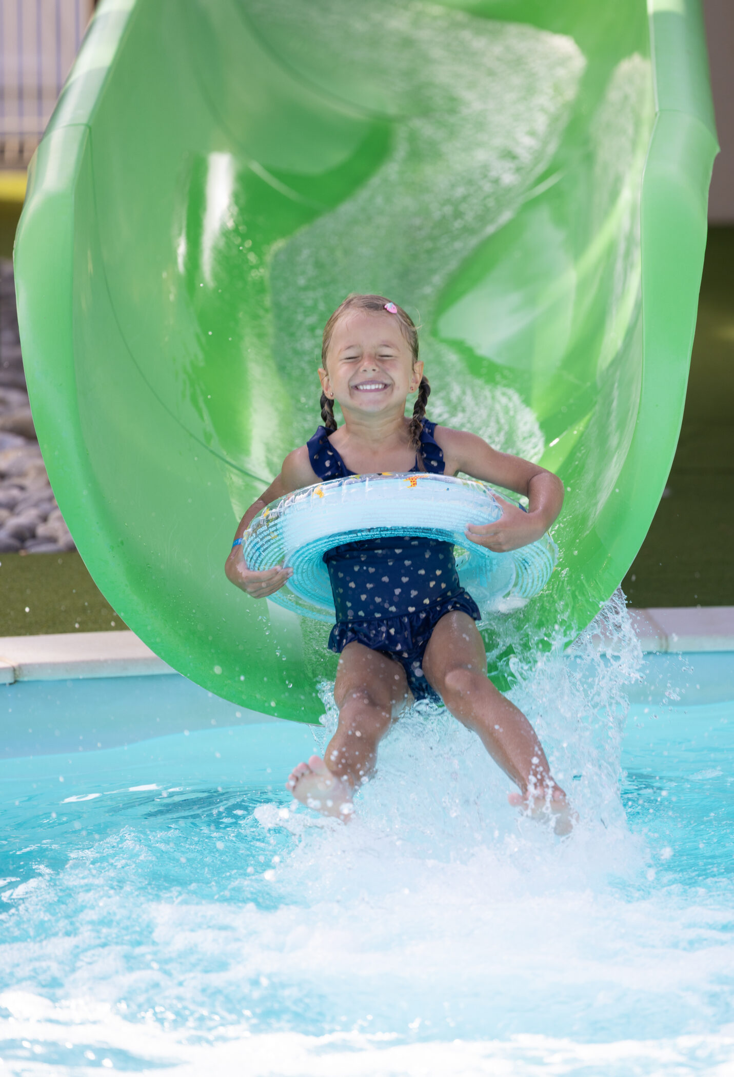 going down the water slide at the campsite water park in the Vendée